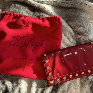 Red patent studded clutch from zac posen